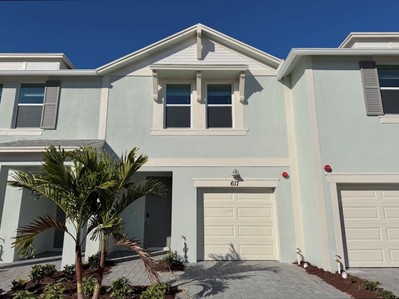 Front exterior of a new home in Tidewater, Fort Pierce, FL, highlighting curb appeal (Image 1). Front exterior of a new home in Tidewater, Fort Pierce, FL, highlighting curb appeal (Image 1).