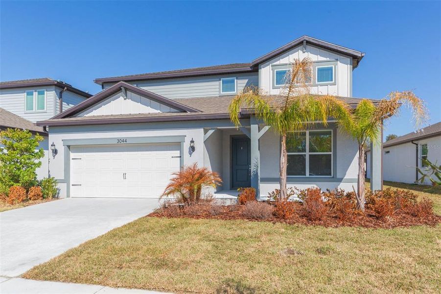 Front exterior of a new home in Valri Forest, Valrico, FL, highlighting curb appeal (Image 1). Front exterior of a new home in Valri Forest, Valrico, FL, highlighting curb appeal (Image 1).