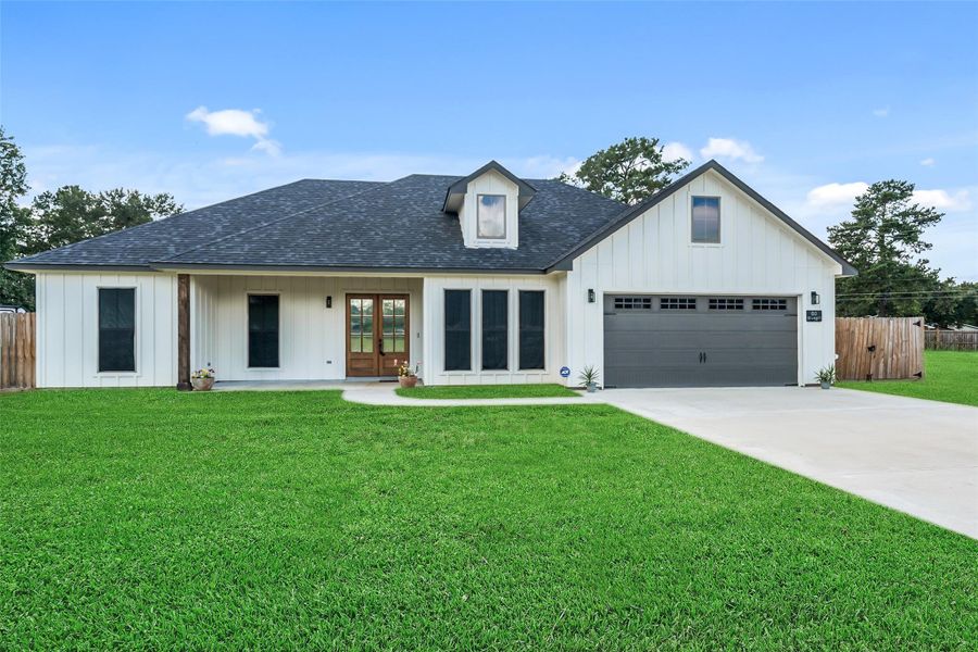 Front exterior of a new home in , Shepherd, TX, highlighting curb appeal (Image 23).