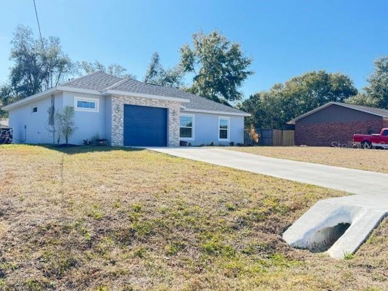 Front exterior of a new home in , Ocklawaha, FL, highlighting curb appeal (Image 19).