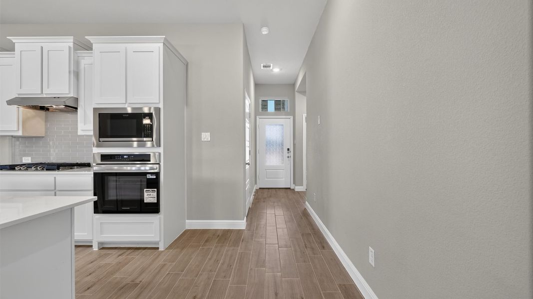 Representative furnished interior of a home built from the Desert Willow by D.R. Horton in Treeline, Justin (Image 6).