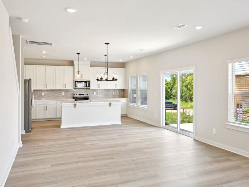 The open-concept floorplan allows for an easy flow between the kitchen and dining areas.