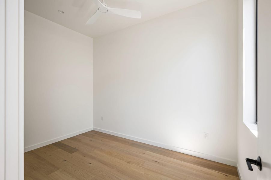 Smooth plaster walls and wide-plank wood floors define this minimalist modern space.