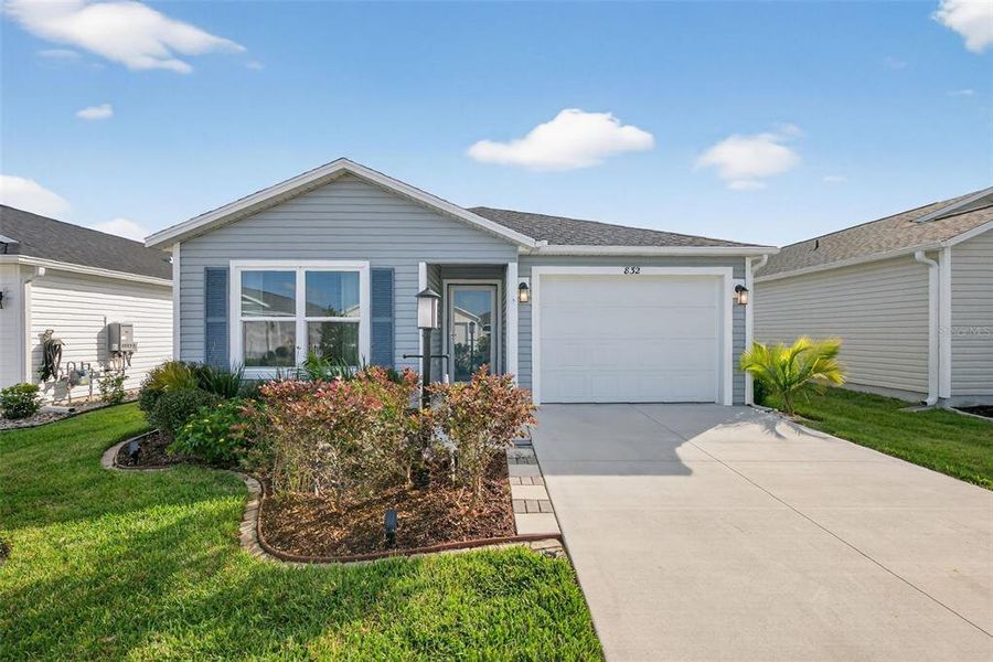 Front exterior of a new home in , The Villages, FL, highlighting curb appeal (Image 22).