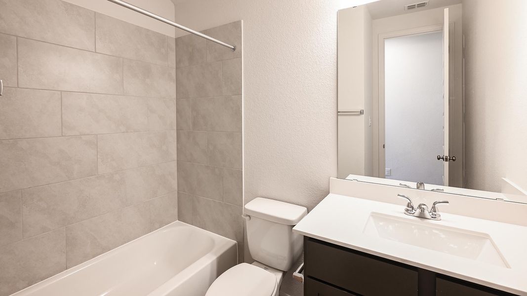 Furnished interior view inside a new home in Crosswinds, Kyle (Image 15).