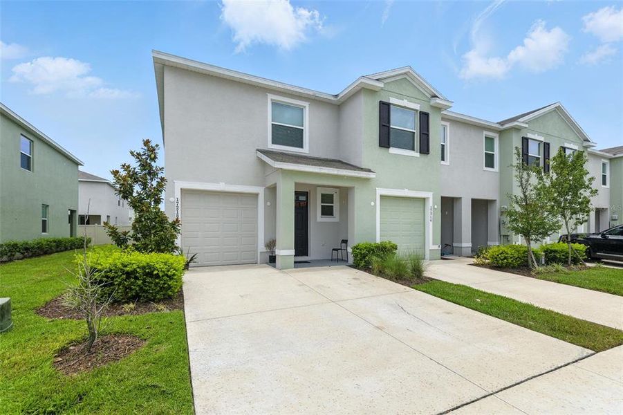 Front exterior of a new home in Westwood, Land O' Lakes, FL, highlighting curb appeal (Image 18). Front exterior of a new home in Westwood, Land O' Lakes, FL, highlighting curb appeal (Image 18).