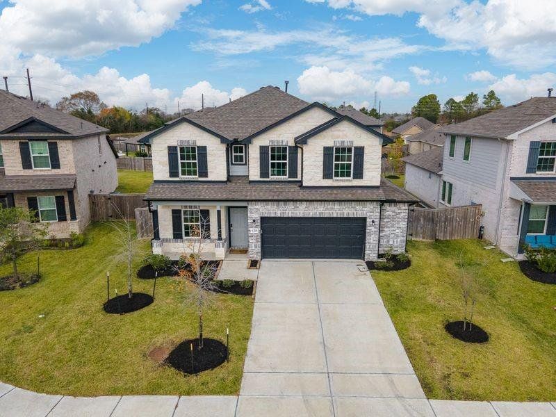 Front exterior of a new home in , Pearland, TX, highlighting curb appeal (Image 1). Front exterior of a new home in , Pearland, TX, highlighting curb appeal (Image 1).
