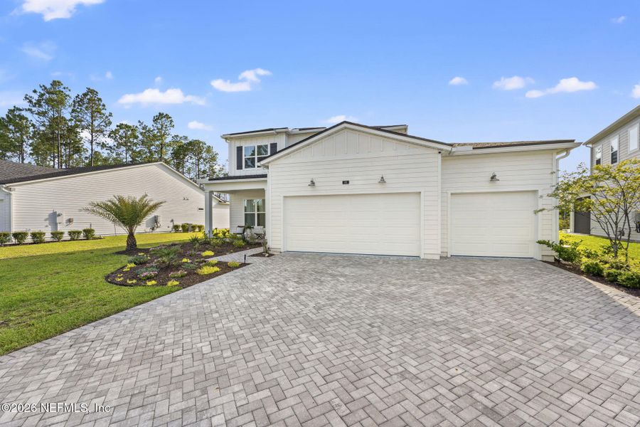 Front exterior of a new home in , St. Johns, FL, highlighting curb appeal (Image 22). Front exterior of a new home in , St. Johns, FL, highlighting curb appeal (Image 22).