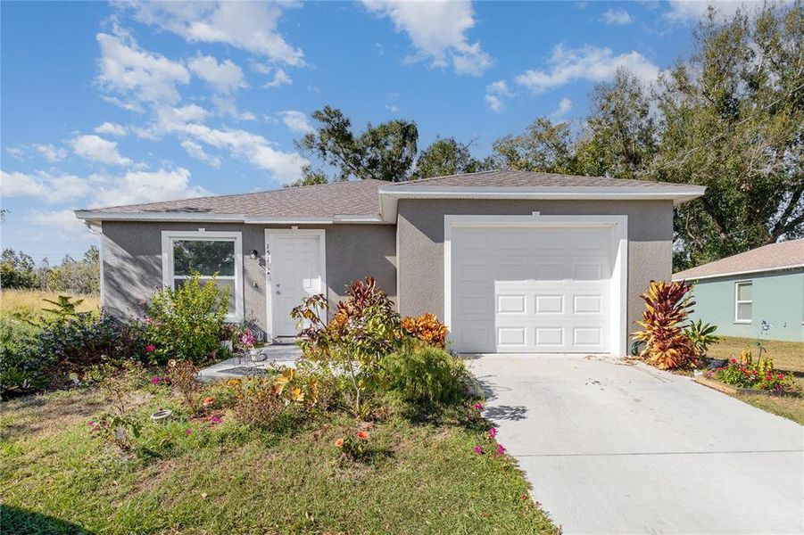 Front exterior of a new home in , Winter Haven, FL, highlighting curb appeal (Image 18). Front exterior of a new home in , Winter Haven, FL, highlighting curb appeal (Image 18).