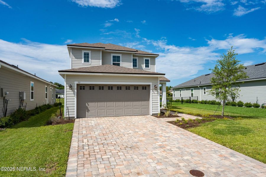Front exterior of a new home in , St. Augustine, FL, highlighting curb appeal (Image 23).