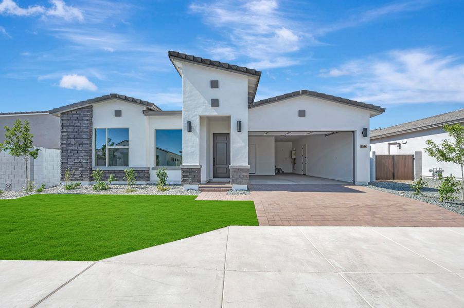Front exterior of a new home in Alston at Soleo, San Tan Valley, AZ, highlighting curb appeal (Image 2). Front exterior of a new home in Alston at Soleo, San Tan Valley, AZ, highlighting curb appeal (Image 2).