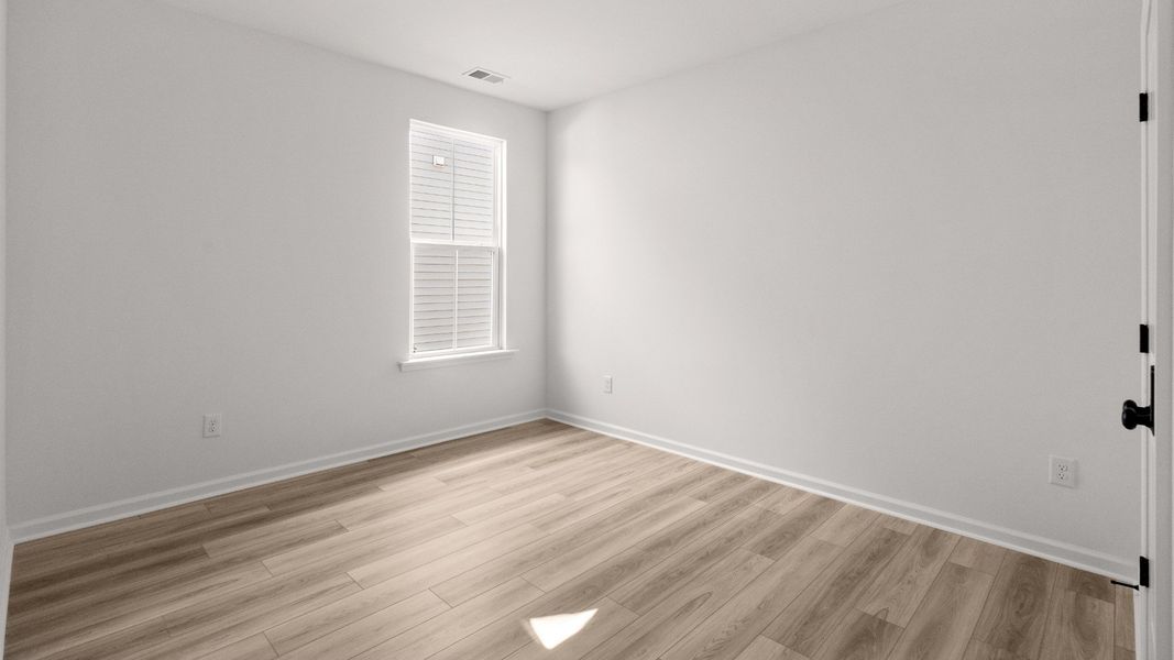 Bedroom 3 in the Easton plan offers a versatile space with natural light and clean finishes.