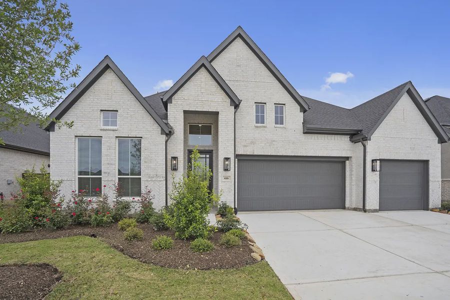 Front exterior of a new home in Attwater 65's, Waller, TX, highlighting curb appeal (Image 24).