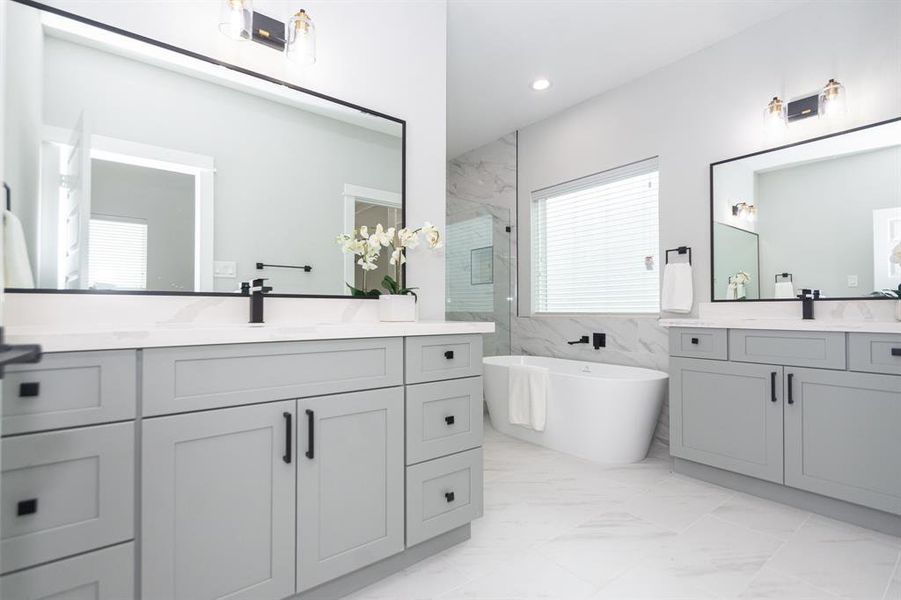 Step into your luxurious primary bathroom, a haven of modern design and functionality with gleaming porcelain tile flooring that extends seamlessly throughout the room. Its neutral tones create a calming atmosphere, allowing other elements to shine.