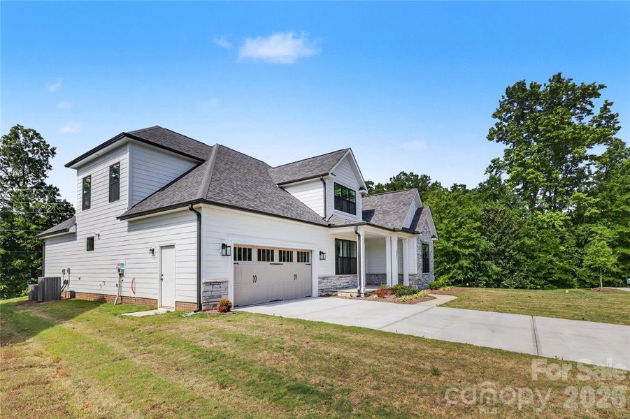 Front exterior of a new home in , Mint Hill, NC, highlighting curb appeal (Image 18).