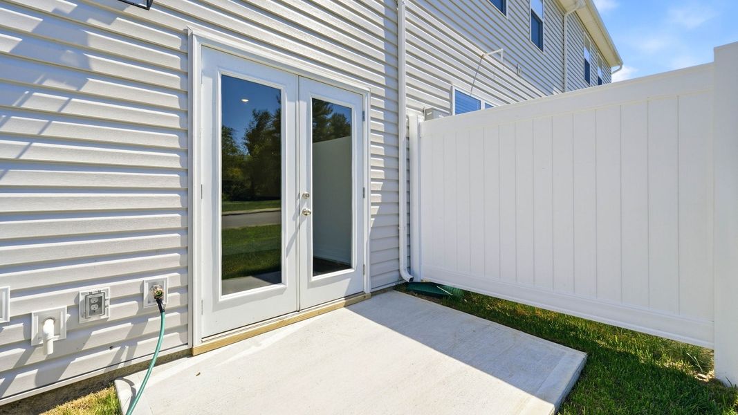 Exterior details and patio area of a home in The Arbor Townhomes, Kingsport (Image 17).
