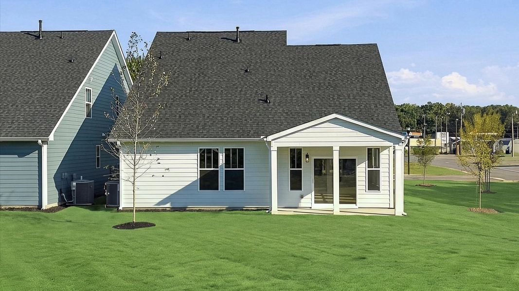 Warm and inviting outdoor living space with a covered rear porch and tasteful finishes at Barton Hollow Warm and inviting outdoor living space with a covered rear porch and tasteful finishes at Barton Hollow