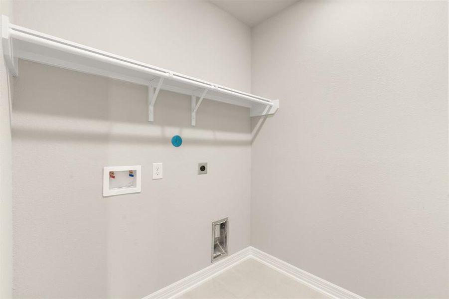 The laundry room layout is carefully planned for optimal workflow with designated areas for washing, drying, and storing.