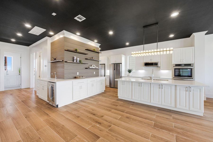 There's a big pantry hidden behind this bar.