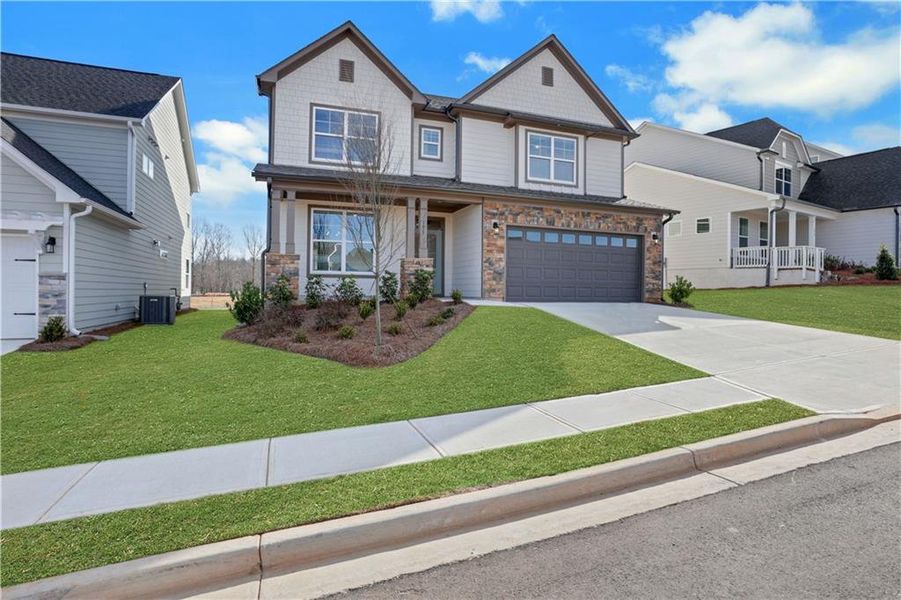 Front exterior of a new home in Twin Lakes, Hoschton, GA, highlighting curb appeal (Image 26).