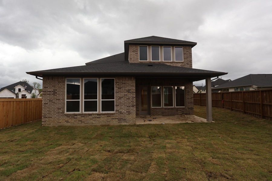 Exterior details and patio area of a home in Woodson’s Reserve, Spring (Image 3).