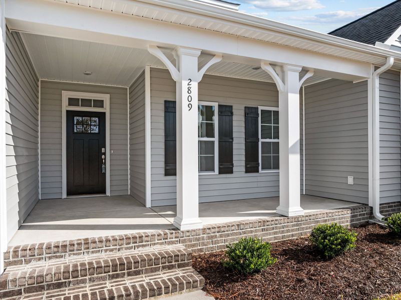 Exterior details and patio area of a home in The Preserve at Langston, Winterville (Image 24). Exterior details and patio area of a home in The Preserve at Langston, Winterville (Image 24).