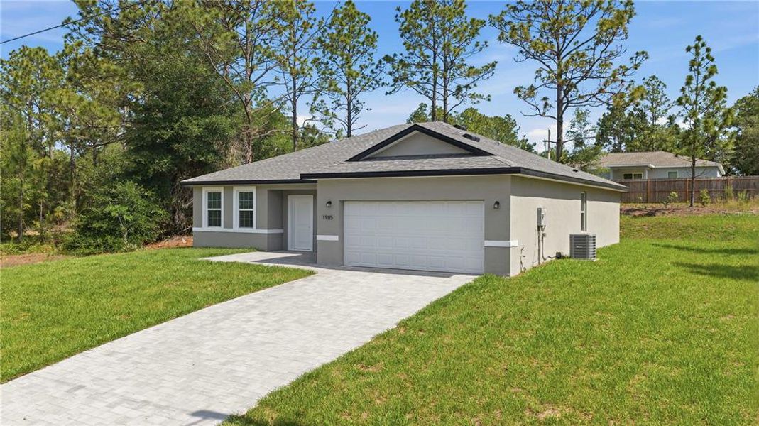 Front exterior of a new home in , Citrus Springs, FL, highlighting curb appeal (Image 2). Front exterior of a new home in , Citrus Springs, FL, highlighting curb appeal (Image 2).