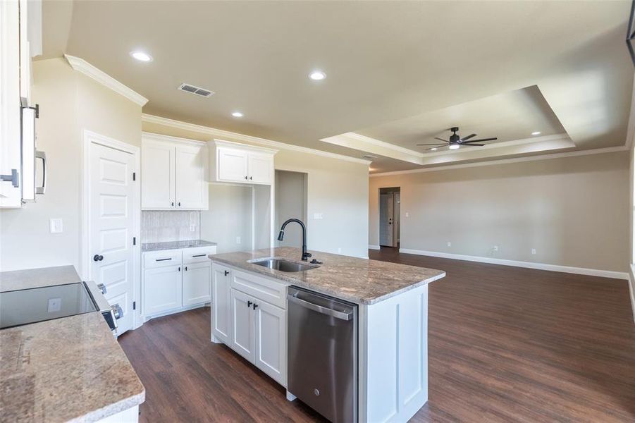Kitchen island with integrated stainless steel sink and dishwasher