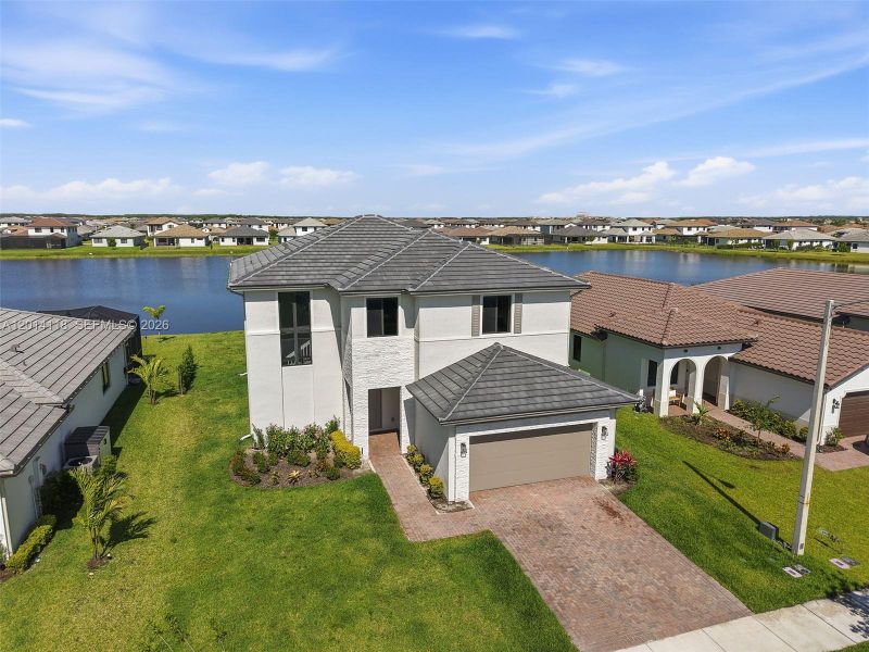 Front exterior of a new home in , Immokalee, FL, highlighting curb appeal (Image 1). Front exterior of a new home in , Immokalee, FL, highlighting curb appeal (Image 1).