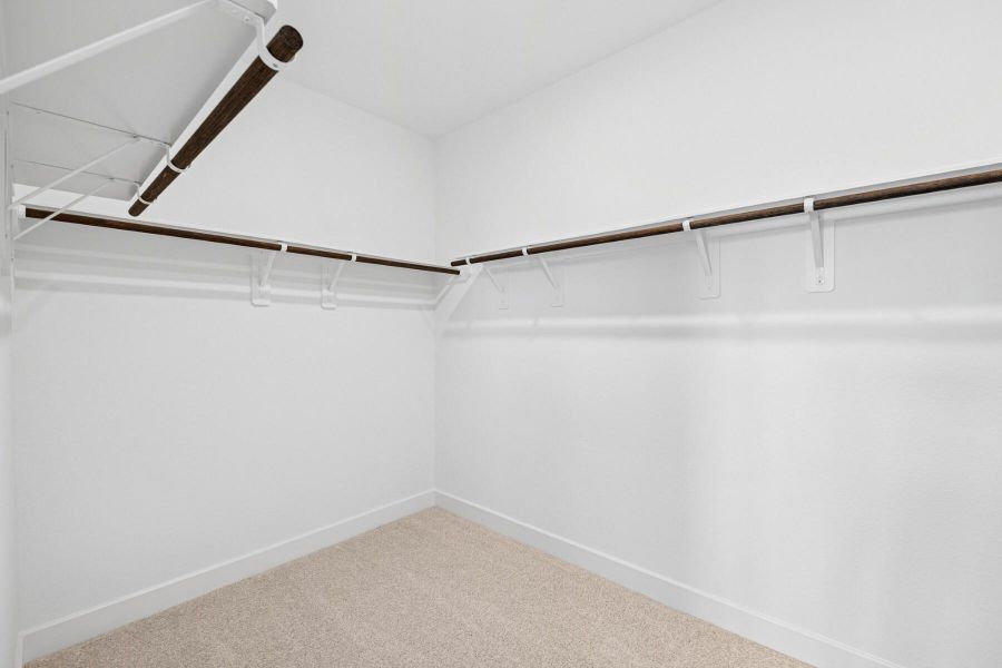 Walk-in closet in the primary suite Walk-in closet in the primary suite