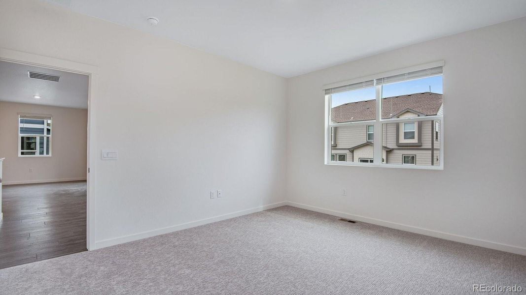 Spacious, unfurnished interior of a new home in Trails at Crowfoot, Parker (Image 22).