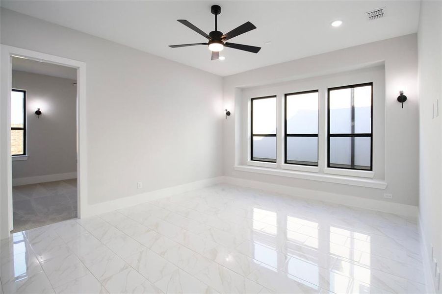 Unfurnished room featuring ceiling fan