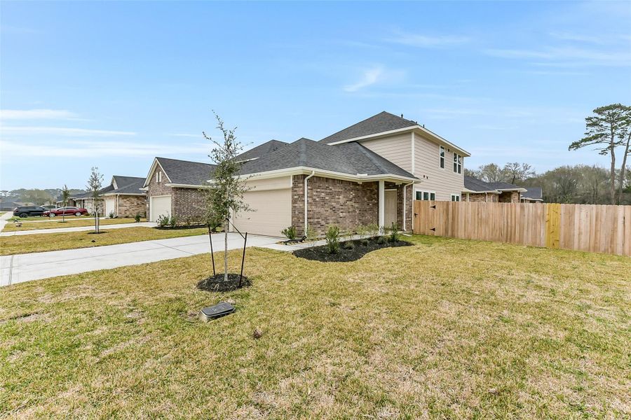 Front exterior of a new home in King Oaks Village, Baytown, TX, highlighting curb appeal (Image 23).