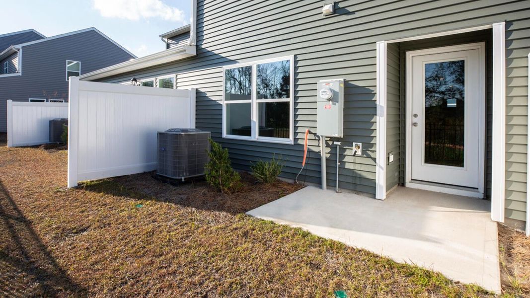 Exterior details and patio area of a home in Townes at Seabrooke, Leland (Image 2).