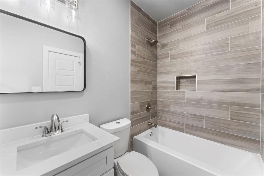 Full bathroom with shower / bathtub combination and vanity