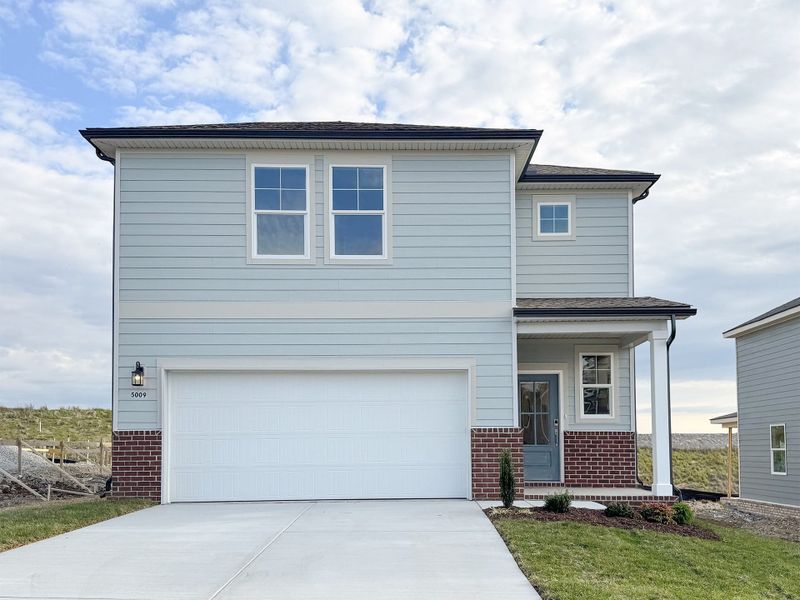 Front exterior of a new home in Canebrake at Hickory Hills, Old Hickory, TN, highlighting curb appeal (Image 1). Front exterior of a new home in Canebrake at Hickory Hills, Old Hickory, TN, highlighting curb appeal (Image 1).
