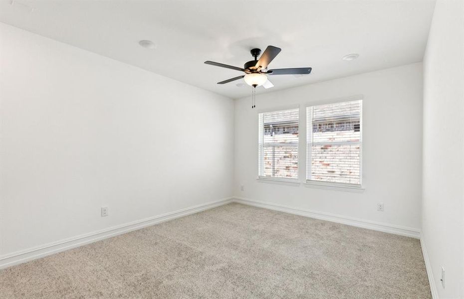 Spacious secondary bedroom with large windows Spacious secondary bedroom with large windows