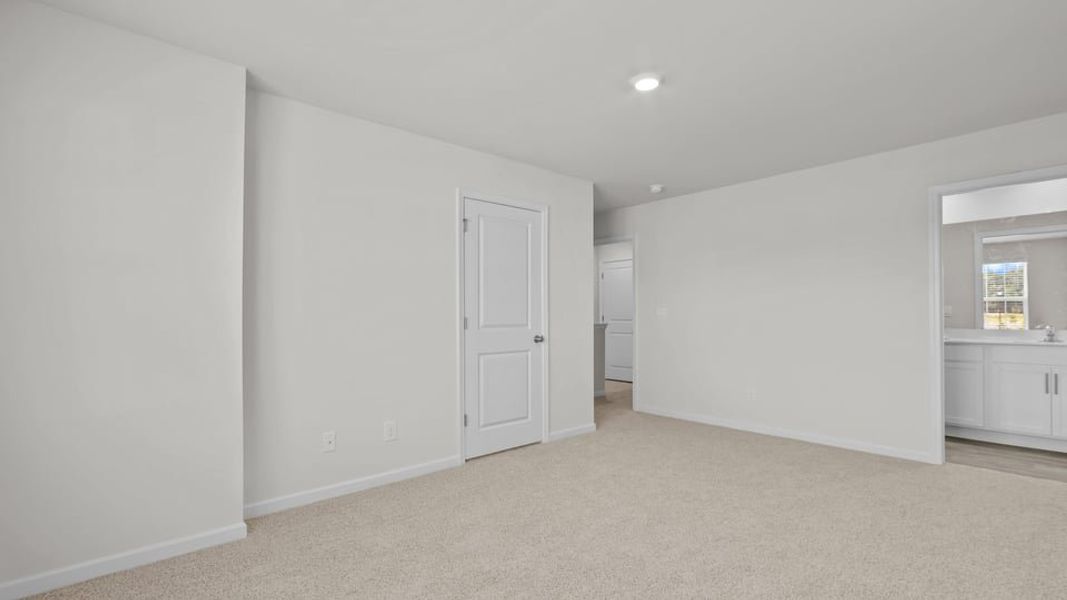 Spacious, unfurnished interior of a new home in The Townes at Ridgewood Farms, Winterville (Image 26).