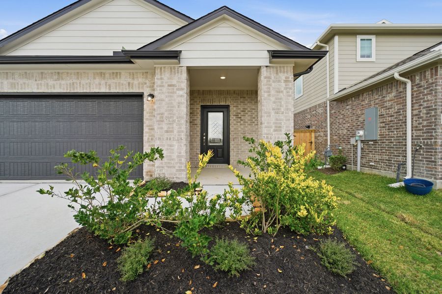 Exterior details and patio area of a home in Windrose Green, Angleton (Image 4).