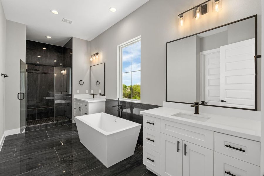 Incredible primary bathroom with soaking tub and standing shower