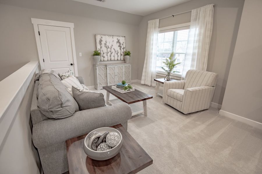 Representative furnished interior of a home built from the Willow by Grant & Co in Manor at Hall Creek, Arlington (Image 65).