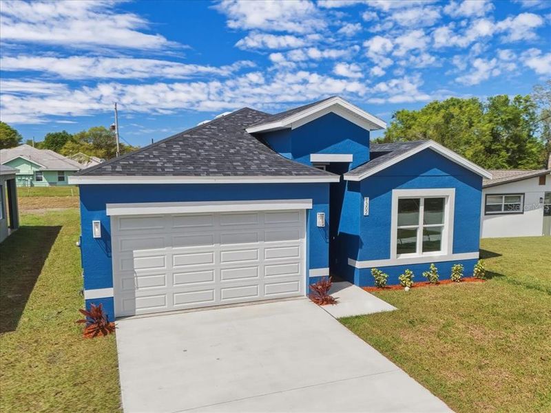 Front exterior of a new home in , Orlando, FL, highlighting curb appeal (Image 2). Front exterior of a new home in , Orlando, FL, highlighting curb appeal (Image 2).