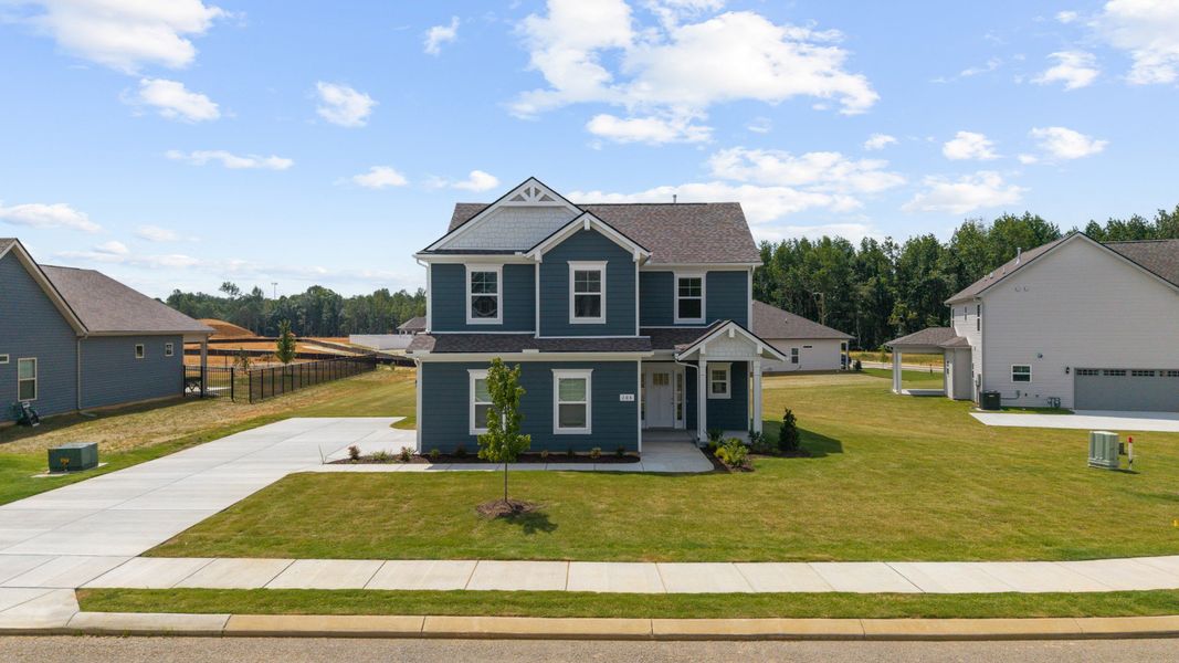 Front exterior of a new home in Stillwater, Tullahoma, TN, highlighting curb appeal (Image 20). Front exterior of a new home in Stillwater, Tullahoma, TN, highlighting curb appeal (Image 20).