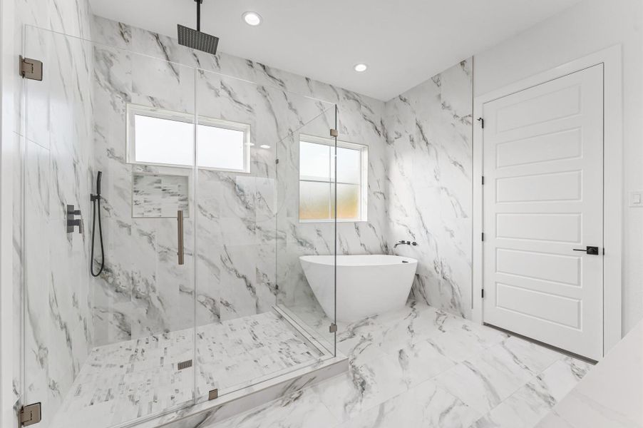 Spa-inspired bath with soaking tub, oversized walk-in shower, and double vanities.Upgraded finishes and thoughtful layout make this a luxurious everyday escape. Spa-inspired bath with soaking tub, oversized walk-in shower, and double vanities.Upgraded finishes and thoughtful layout make this a luxurious everyday escape.