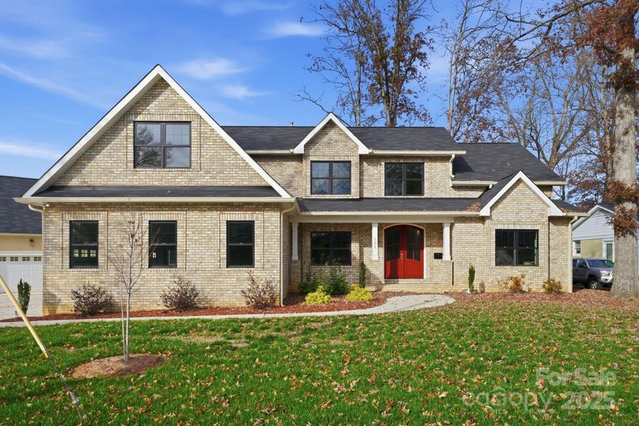Stunning full front elevation with red double-door entry — a true modern classic. Stunning full front elevation with red double-door entry — a true modern classic.