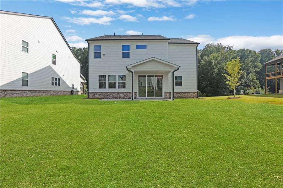 Exterior details and patio area of a home in The Paddocks at Doc Hughes, Buford (Image 24).