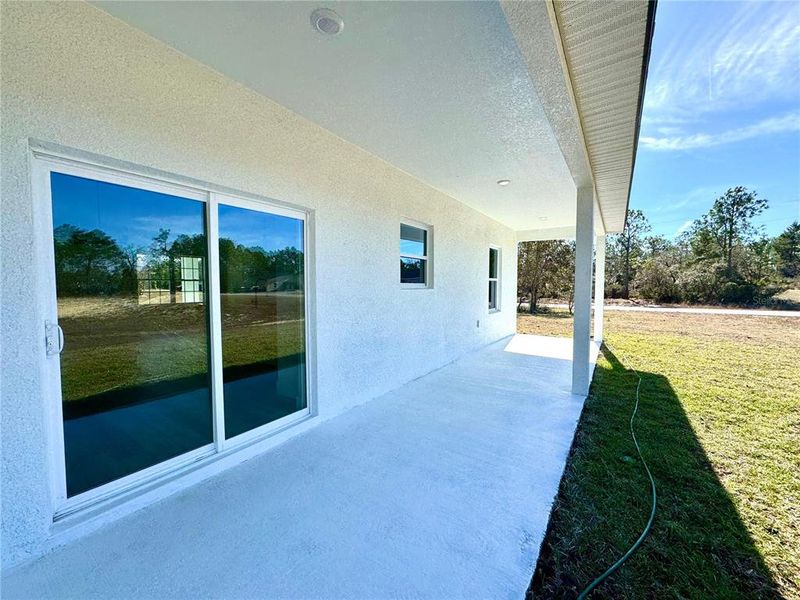 Exterior details and patio area of a home in , Citrus Springs (Image 18).