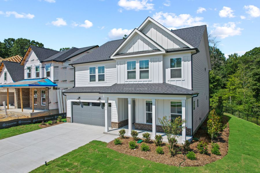 Front exterior of a new home in Elmbrook, Indian Trail, NC, highlighting curb appeal (Image 36). Front exterior of a new home in Elmbrook, Indian Trail, NC, highlighting curb appeal (Image 36).
