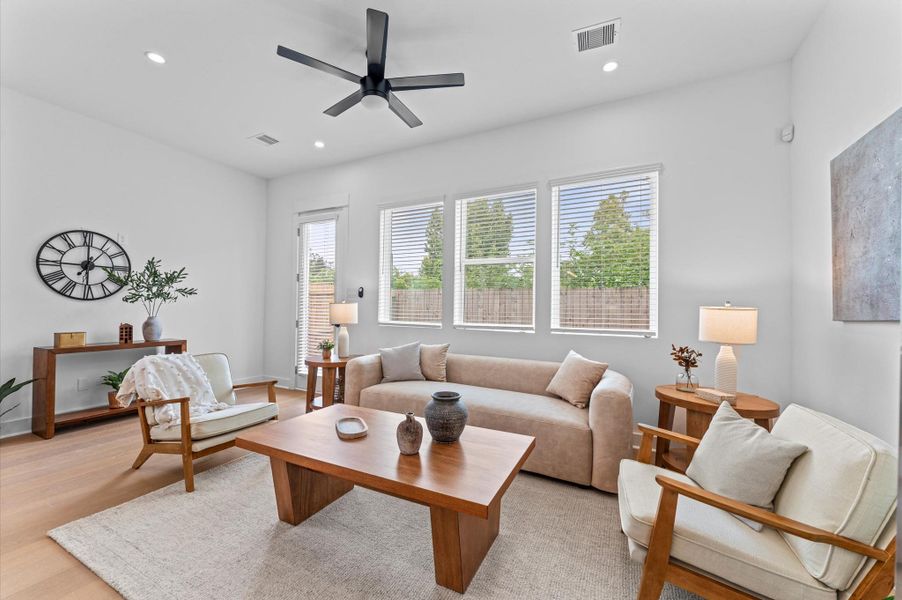 Airy and inviting open-concept living space located on the first floor, thoughtfully designed to enhance both comfort and flow. The area features high ceilings, expansive windows, and cohesive flooring that unify the living, dining, and kitchen zones. Airy and inviting open-concept living space located on the first floor, thoughtfully designed to enhance both comfort and flow. The area features high ceilings, expansive windows, and cohesive flooring that unify the living, dining, and kitchen zones.