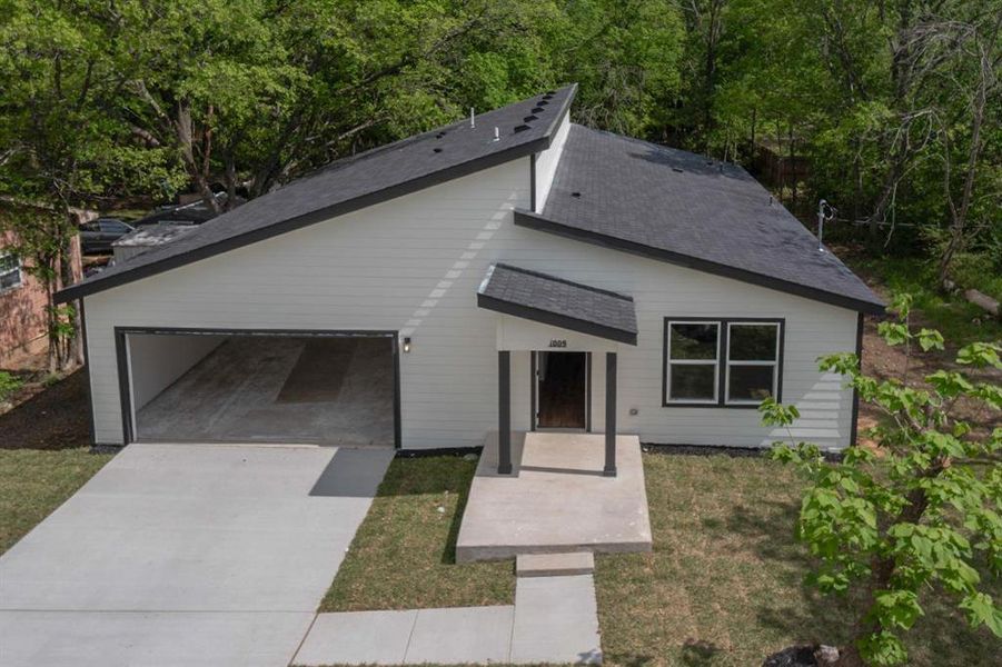 Front exterior of a new home in , Seagoville, TX, highlighting curb appeal (Image 27).